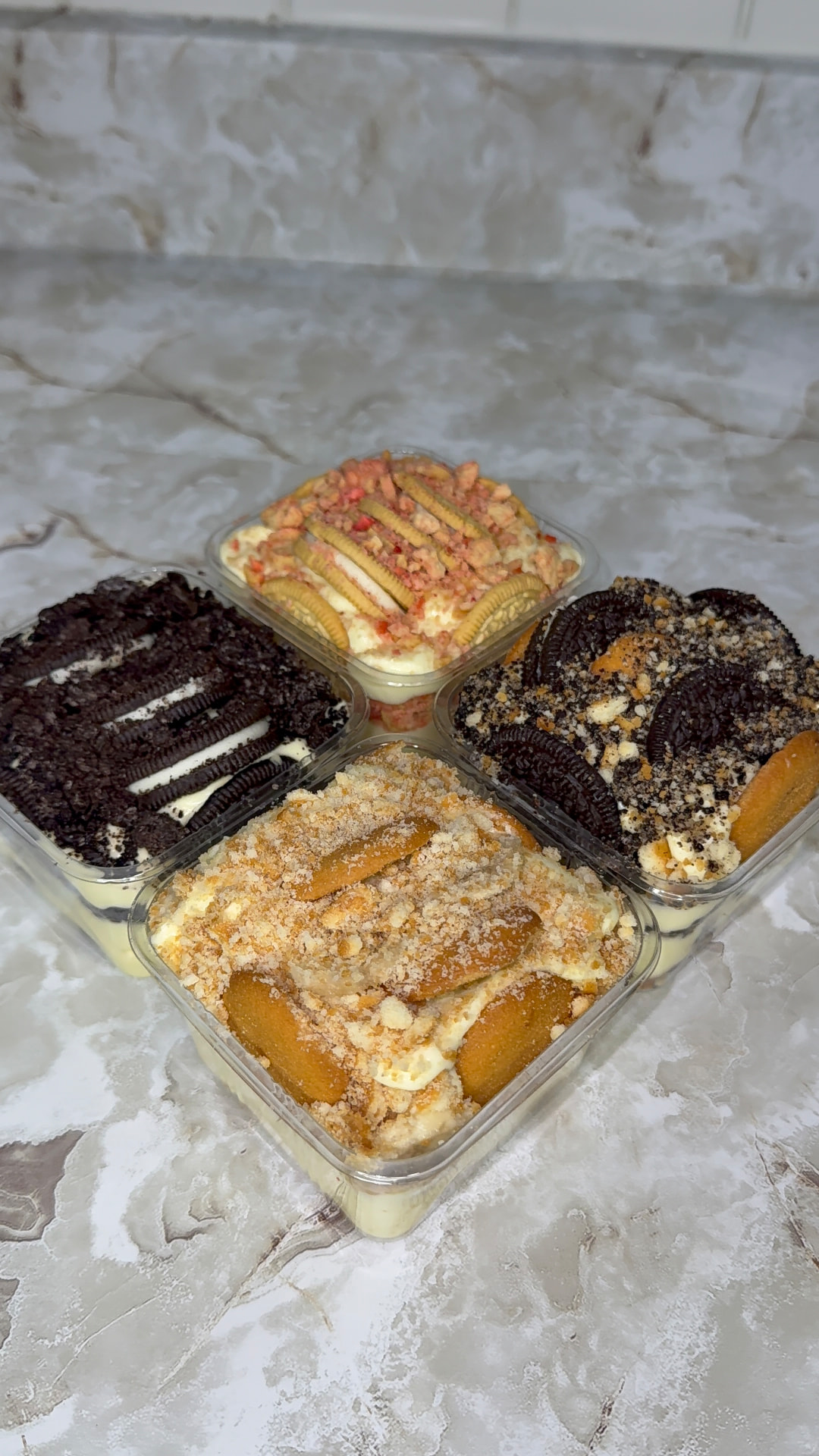 All four Not Nanas flavors — Oreo Craze, Strawberry Crunch, Blondie and Banana Bliss — in clear cups